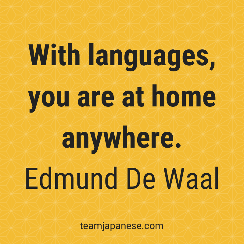 Text graphic on a yellow patterned background reads: "With languages, you are at home anywhere. Edmund De Waal." Perfect for fans of inspirational quotes about language learning. Website "teamjapanese.com" appears at the bottom.
