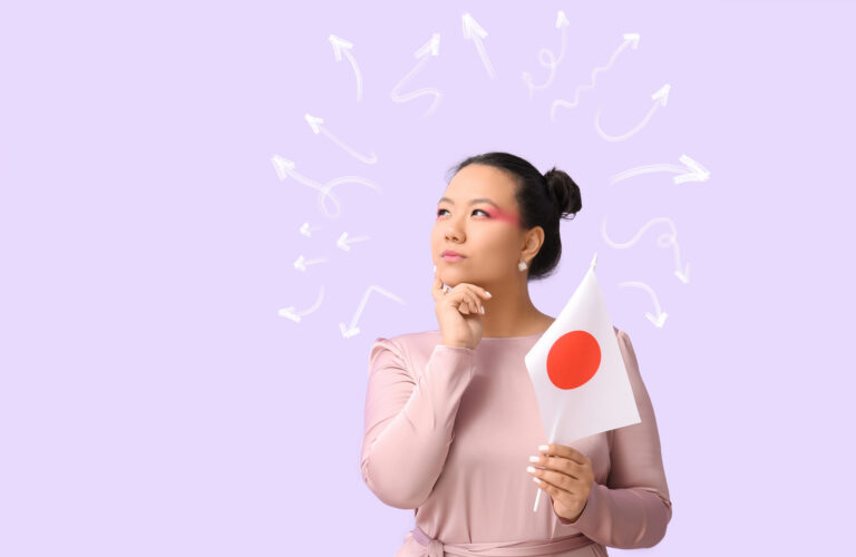 A woman holding a Japanese flag stands thoughtfully against a light purple background, with white arrows drawn above her head in various directions, as if she’s deciding between japanesepod101 vs duolingo for her language learning journey.
